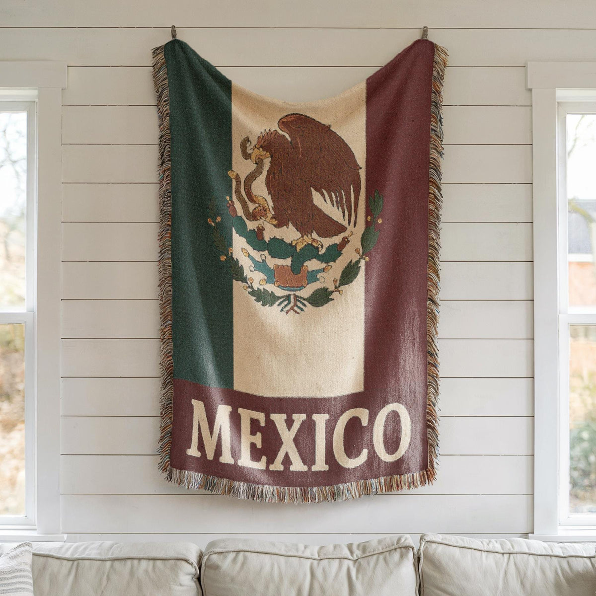 Woven blanket featuring the Mexico flag with eagle coat of arms and MEXICO text