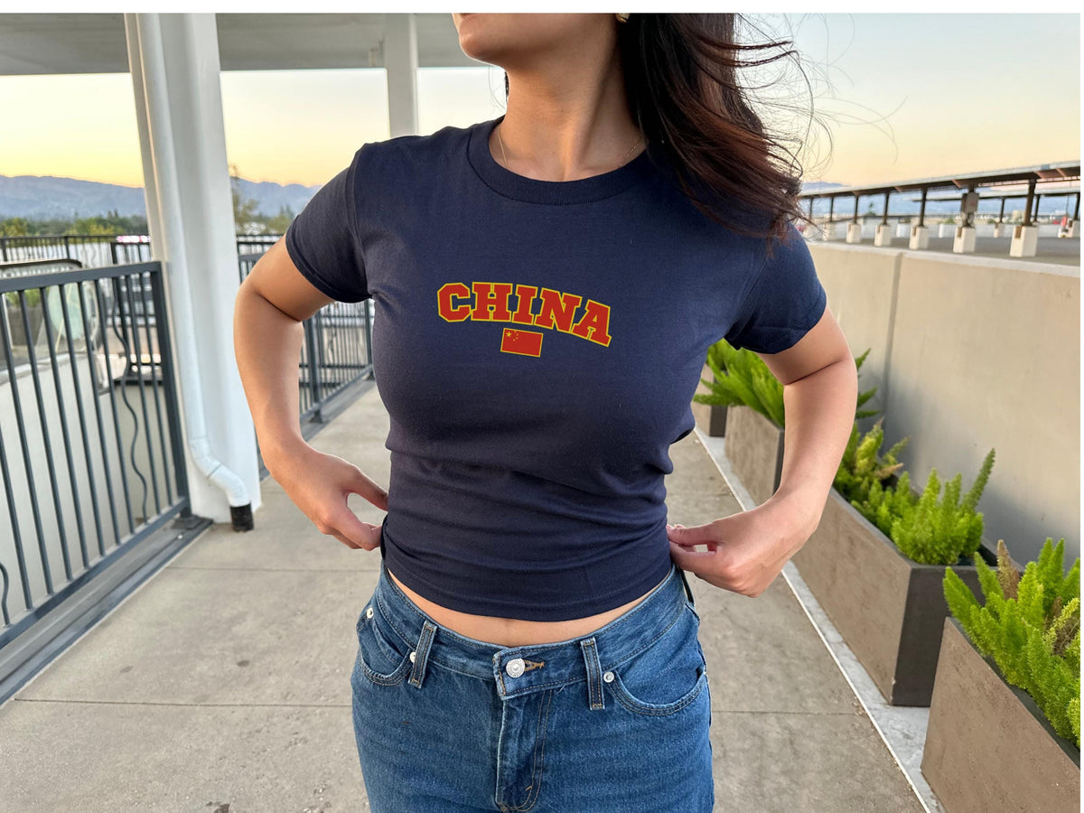Navy baby tee with varsity CHINA lettering and Chinese flag graphic