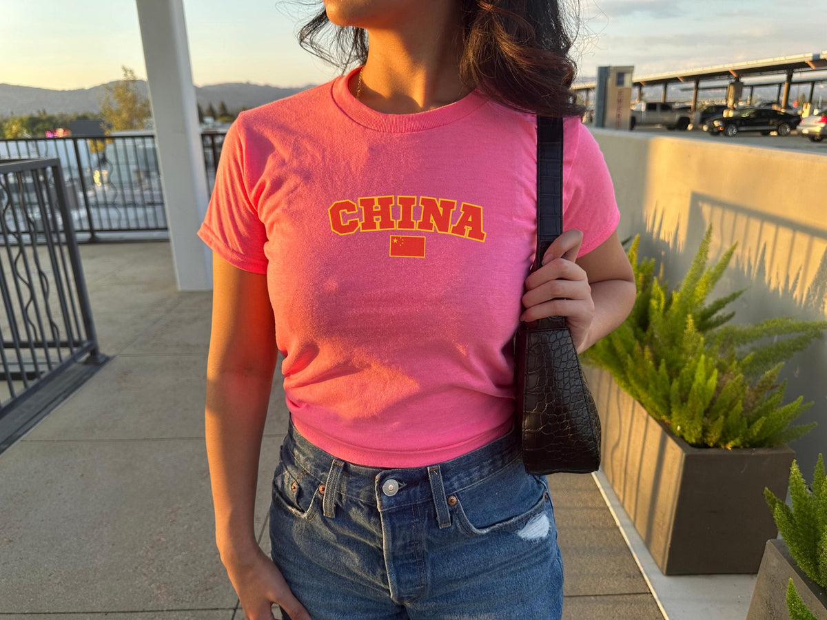 Navy baby tee with varsity CHINA lettering and Chinese flag graphic