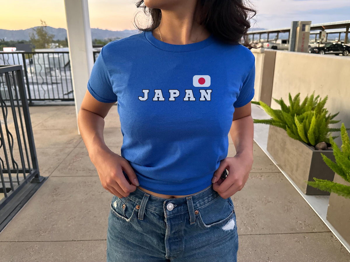 Navy baby tee with bold JAPAN lettering and Japanese flag graphic on the chest