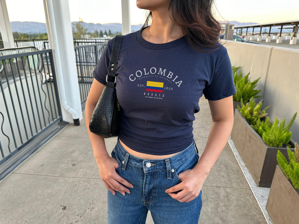 Navy baby tee with Colombia flag, Bogotá, República de Colombia, and EST. 1829 graphic