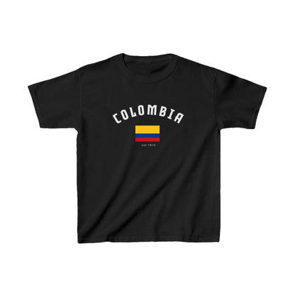 Red baby tee with arched Colombia lettering, Colombian flag, and est. 1810 detail