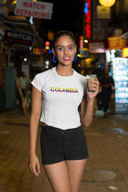 Black baby tee with Colombia wordmark in yellow, blue, and red flag colors and map silhouette