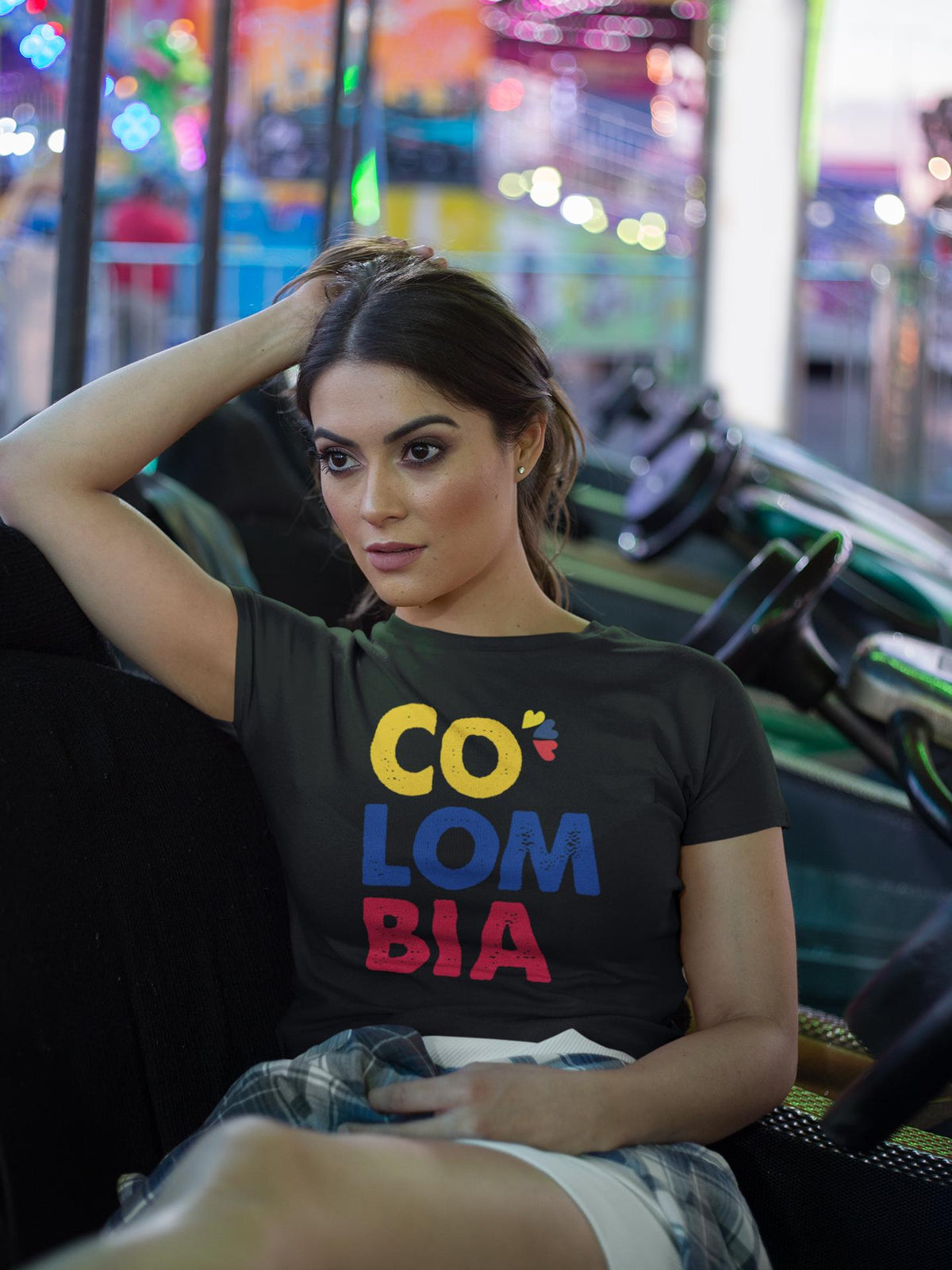 White baby tee with CO LOM BIA text in yellow, blue and red Colombia flag colors