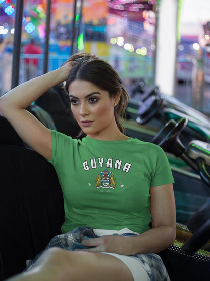 Yellow Guyana baby tee with arched lettering and crest graphic on the front