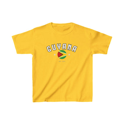 White baby tee with arched Guyana text, circular flag graphic, stars, and est. 1970 detail