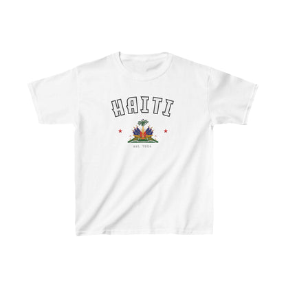 Blue baby tee with arched HAITI lettering, crest-style artwork, stars, and est. 1804 text