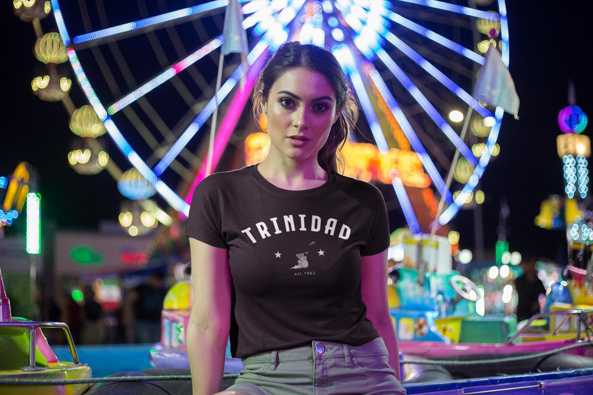 Trinidad baby tee design with arched white lettering, island graphic, stars, and 1962 detail