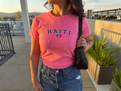 Navy baby tee with varsity HAITI lettering and Haitian flag graphic on the chest