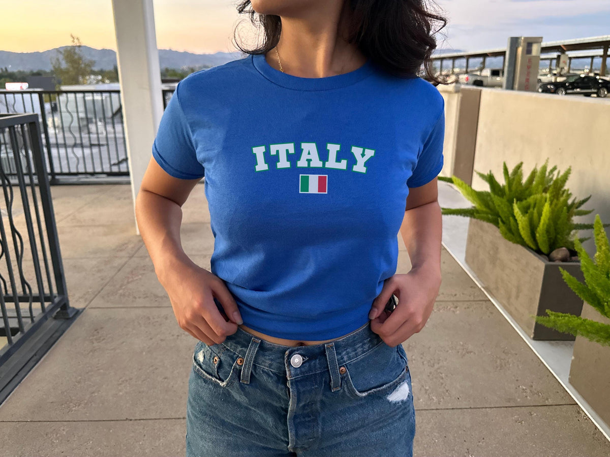 Blue baby tee with varsity ITALY lettering and Italian flag graphic
