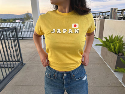 Navy baby tee with bold JAPAN lettering and Japanese flag graphic on the chest
