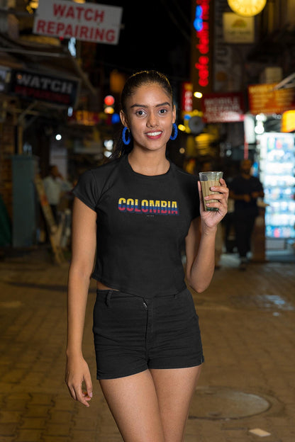 Yellow baby tee with a Colombia wordmark in flag colors on the chest