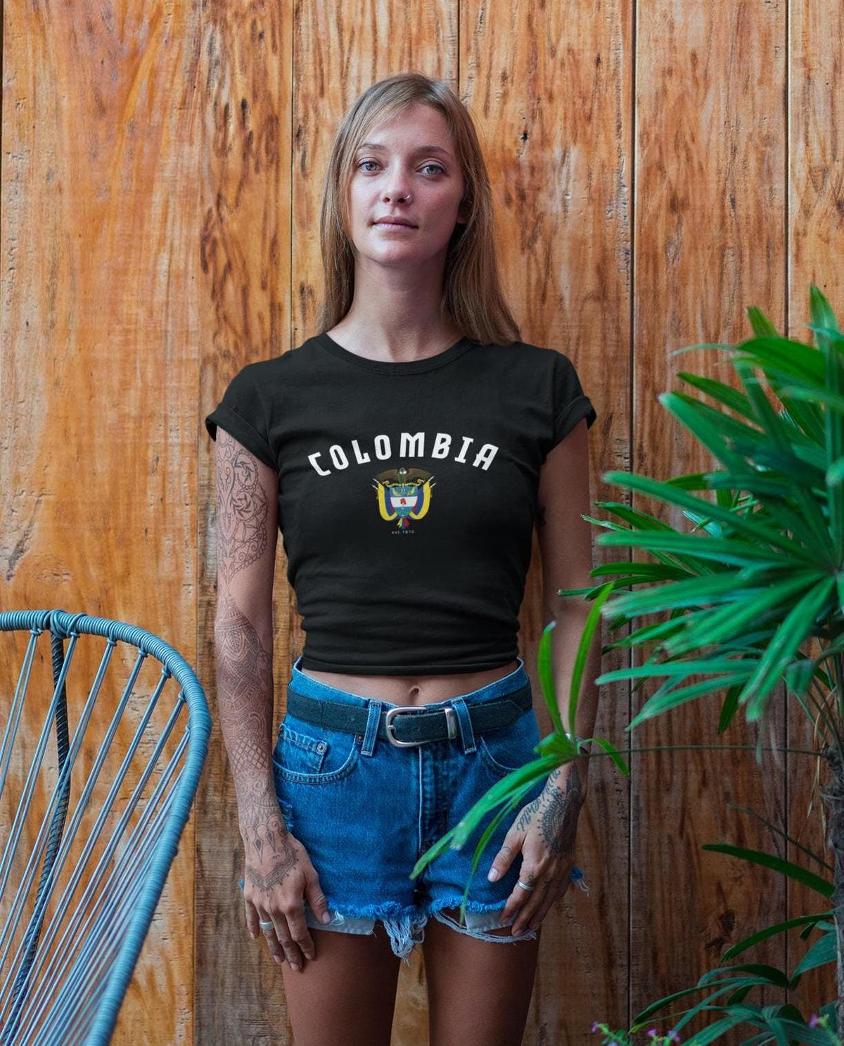 Black baby tee with arched Colombia text and crest graphic on the front