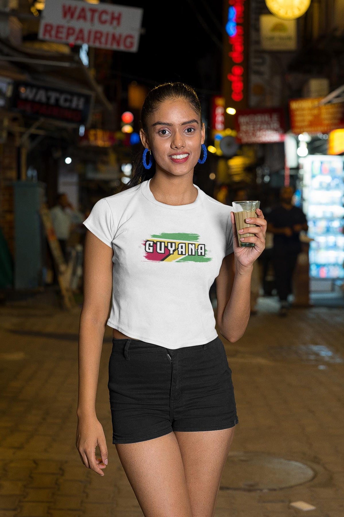 Guyana baby tee with flag brushstroke graphic and bold Guyana lettering