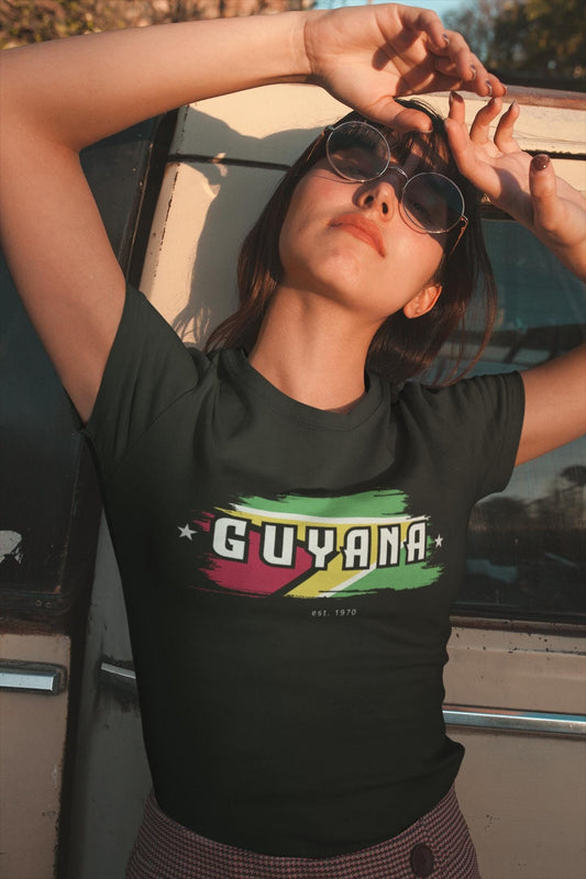Guyana baby tee with flag brushstroke graphic and bold Guyana lettering