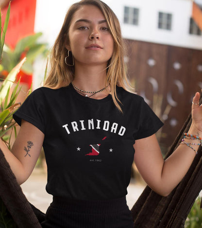 Black baby tee with arched Trinidad text, flag-colored map graphic, stars, and est. 1962 detail
