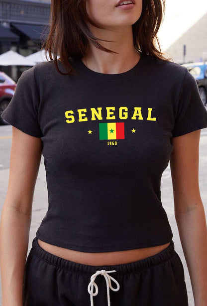 Green baby tee with SENEGAL lettering, Senegal flag, star accents, and 1960 on the front