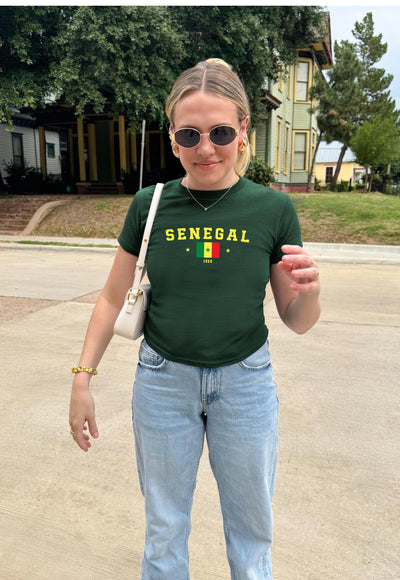 Green baby tee with SENEGAL lettering, Senegal flag, star accents, and 1960 on the front