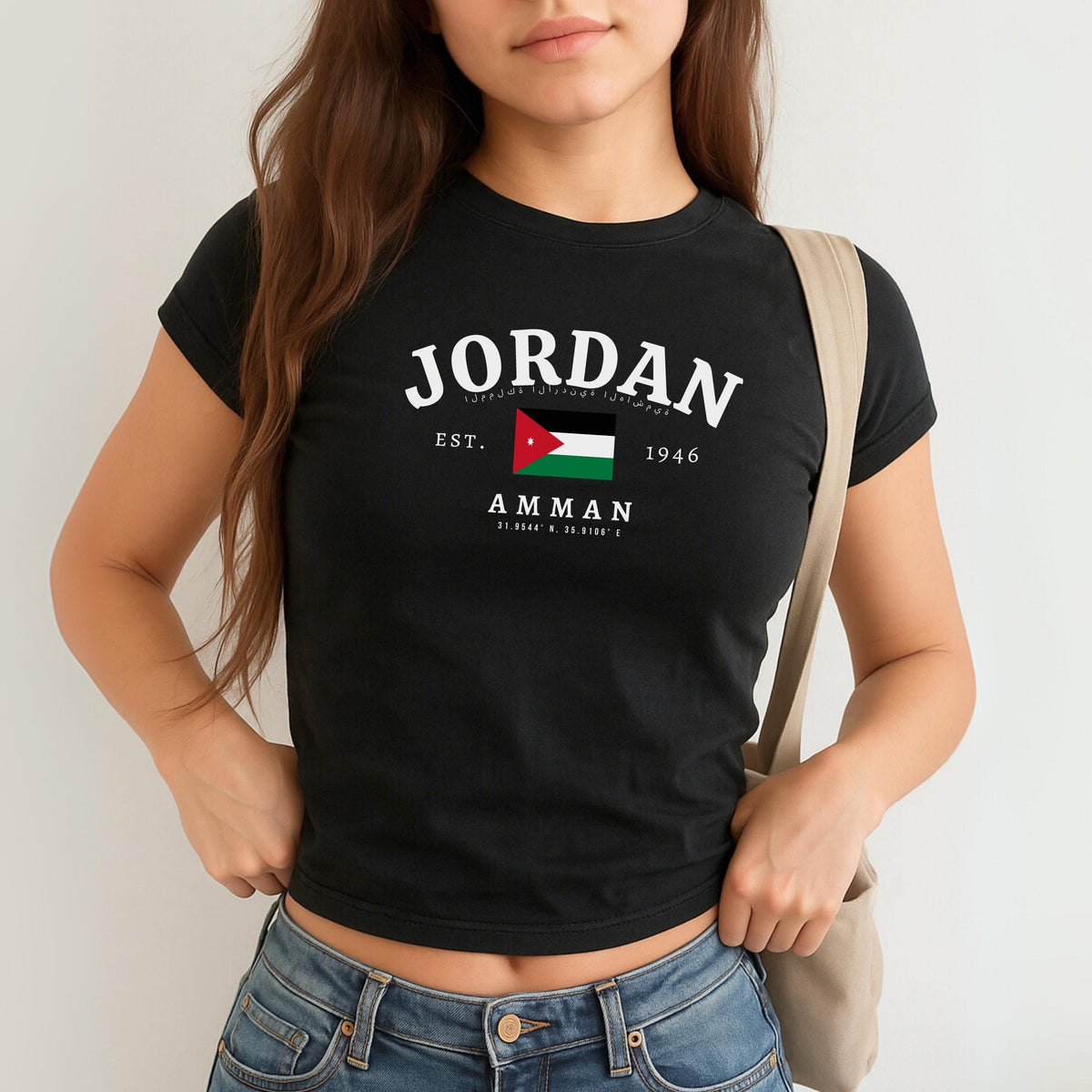 Green baby tee with arched Jordan text, Jordanian flag, Amman, and coordinate design