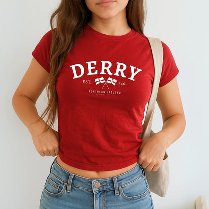 Derry Northern Ireland baby tee design with arched lettering, crossed flags, EST. 546, and coordinates