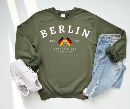 Navy sweatshirt with arched Berlin text, crossed German flags, Deutschland lettering, and 1237 detail