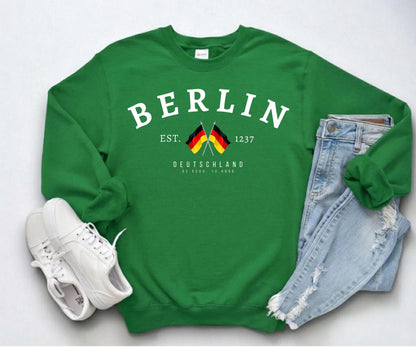Navy sweatshirt with arched Berlin text, crossed German flags, Deutschland lettering, and 1237 detail
