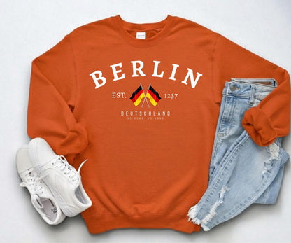 Navy sweatshirt with arched Berlin text, crossed German flags, Deutschland lettering, and 1237 detail