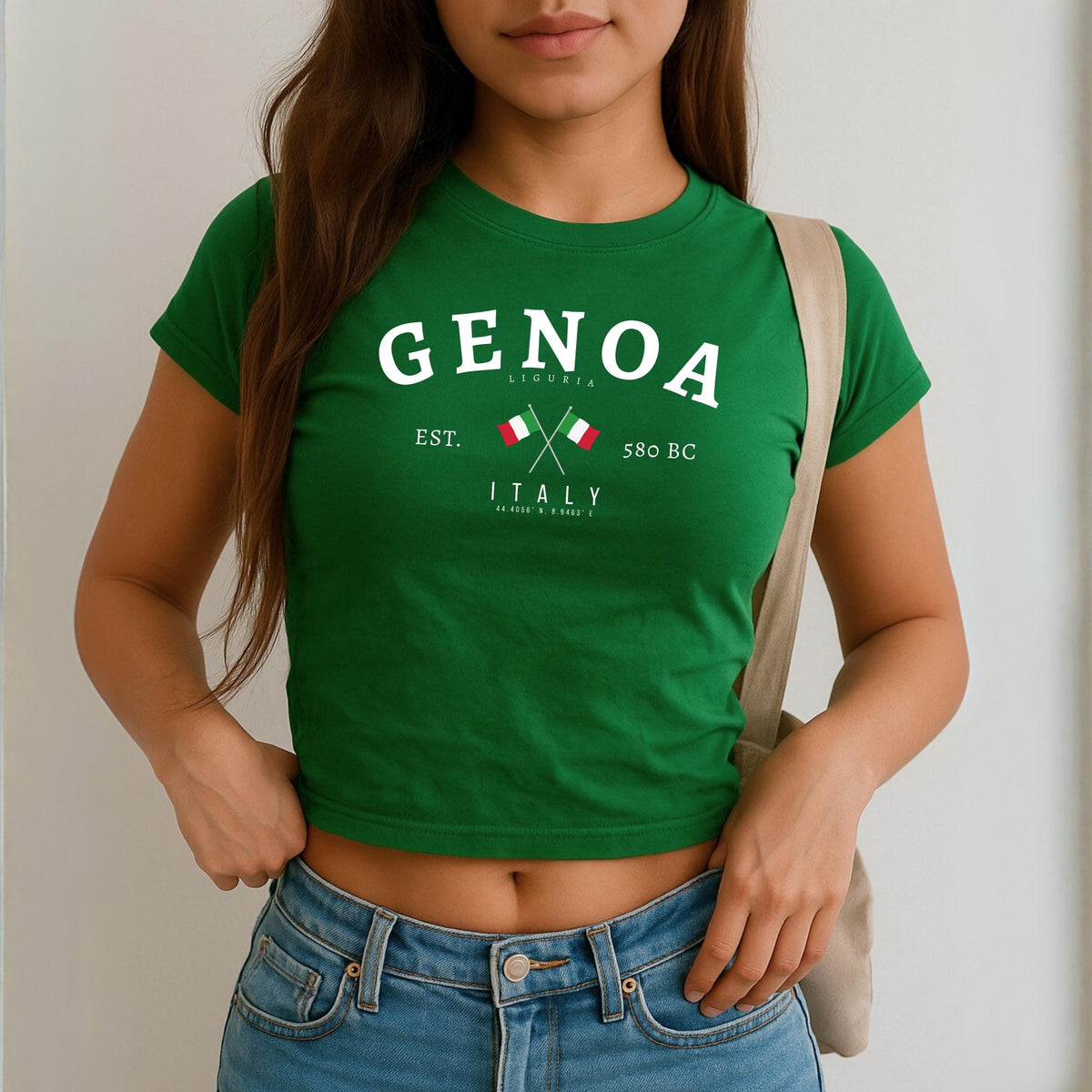 Navy baby tee with Genoa Liguria Italy design, crossed Italian flags, est. 580 BC, and coordinates
