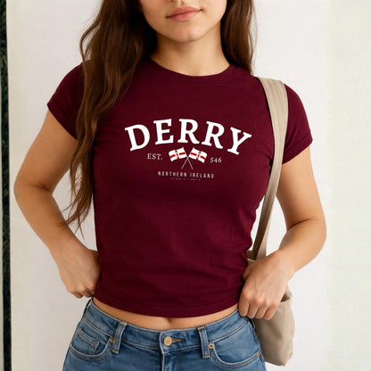 Derry Northern Ireland baby tee design with arched lettering, crossed flags, EST. 546, and coordinates