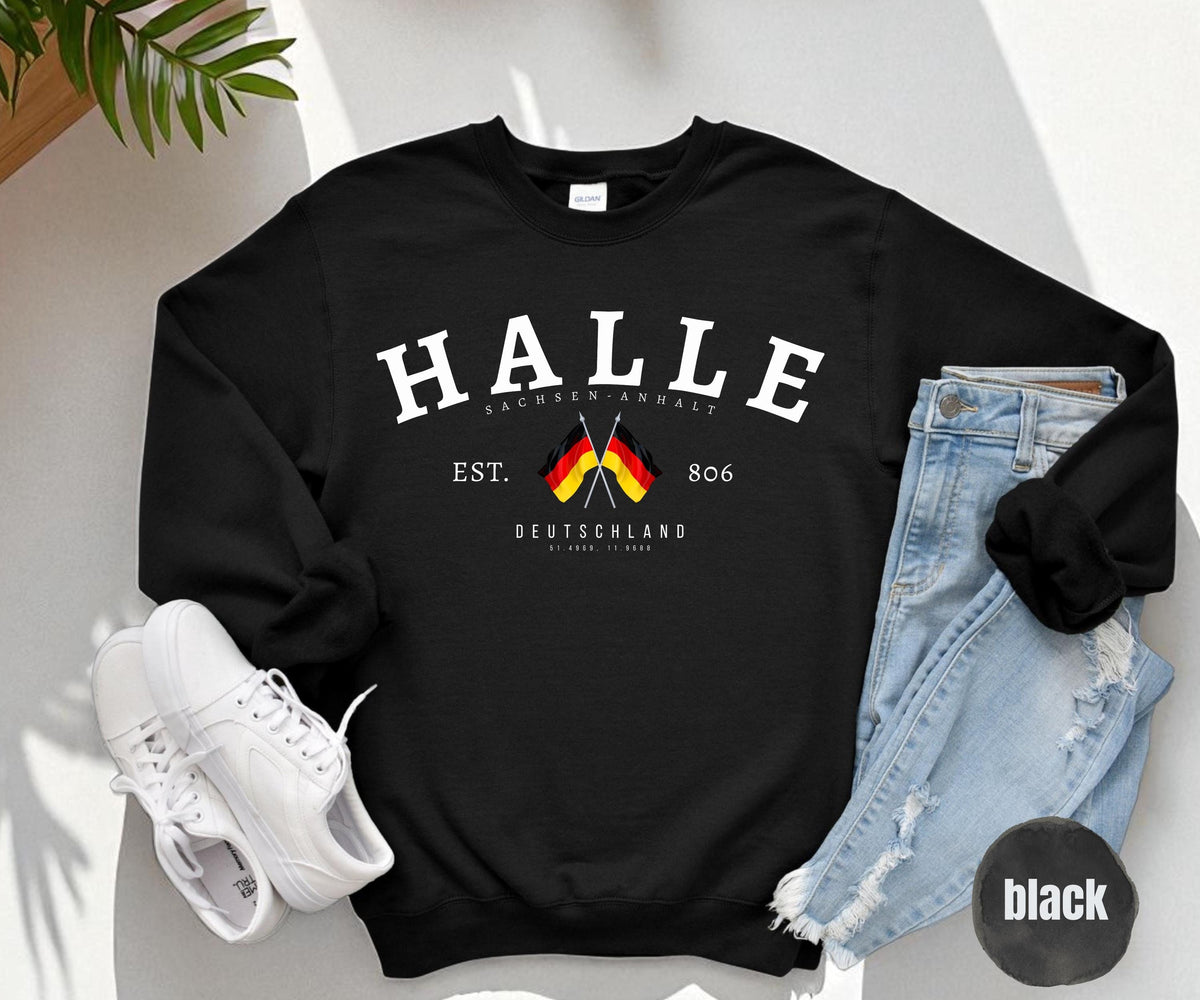 Black sweatshirt with arched HALLE text, Sachsen Anhalt, crossed German flags, EST. 806 and Deutschland coordinates