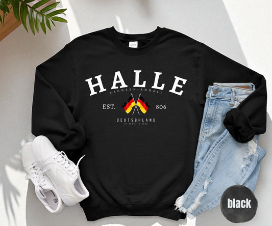 Black sweatshirt with arched HALLE text, Sachsen Anhalt, crossed German flags, EST. 806 and Deutschland coordinates