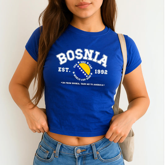 Blue Bosnia baby tee with collegiate flag design, World Cup 2026 text, and take me to America slogan