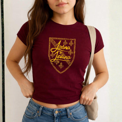 Blue baby tee with yellow Jedina si Jedina shield design and fleur-de-lis details