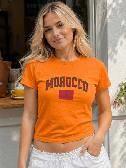 Green baby tee with red arched MOROCCO lettering and Moroccan flag graphic