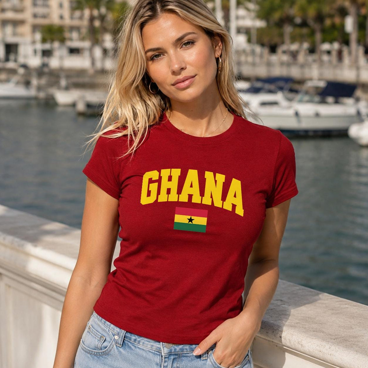 Red baby tee with yellow GHANA lettering and Ghana flag with black star