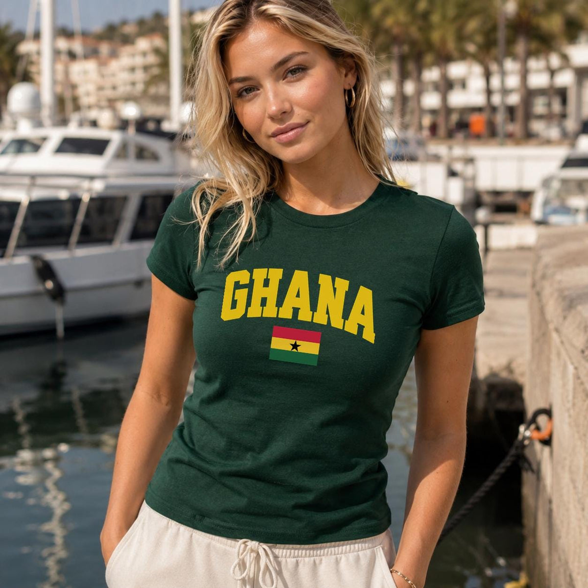 Red baby tee with yellow GHANA lettering and Ghana flag with black star