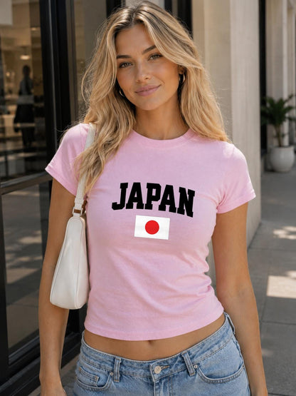 Blue baby tee with bold white JAPAN text and Japan flag graphic