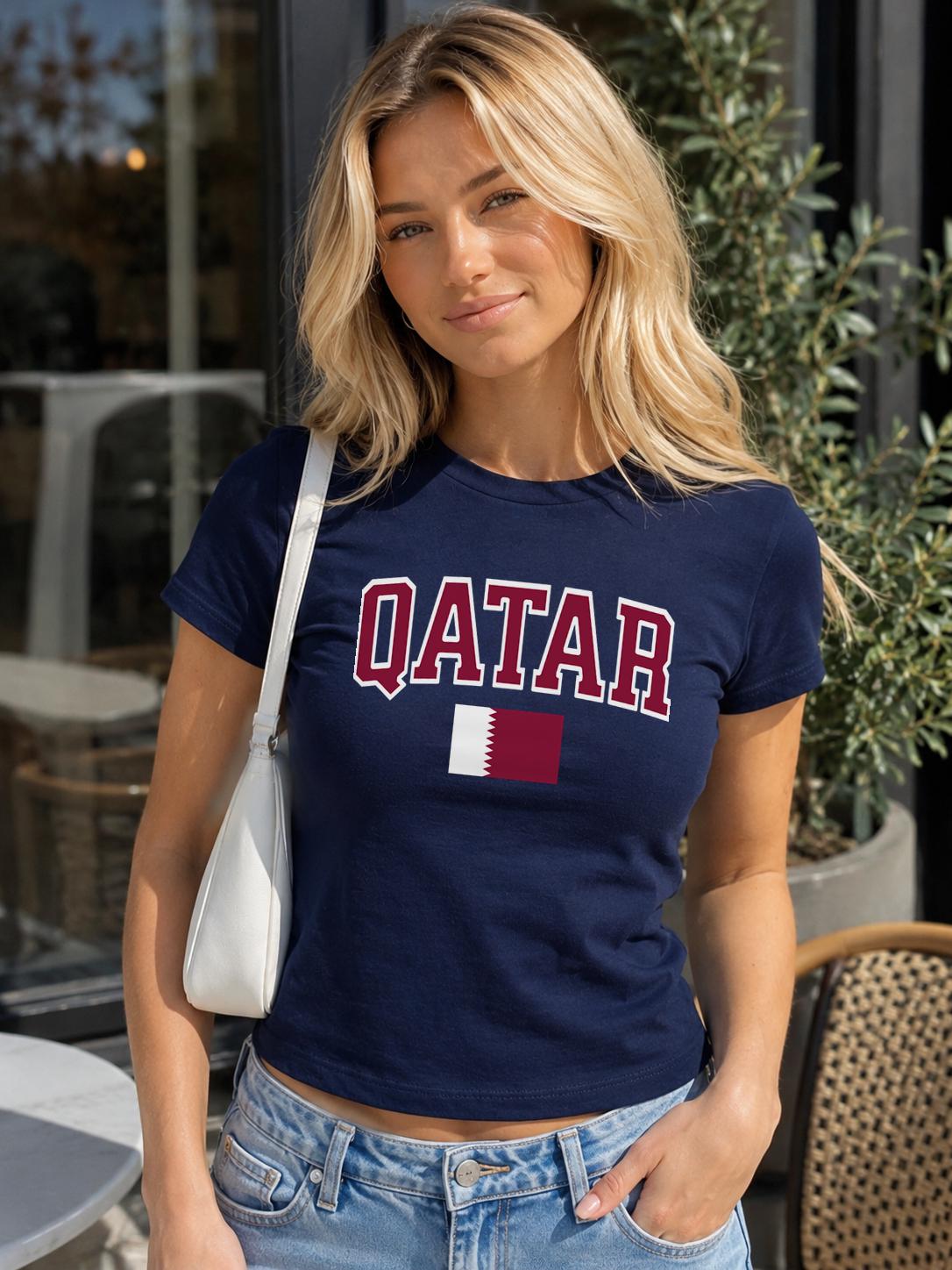 Maroon baby tee with bold QATAR lettering and Qatar flag graphic