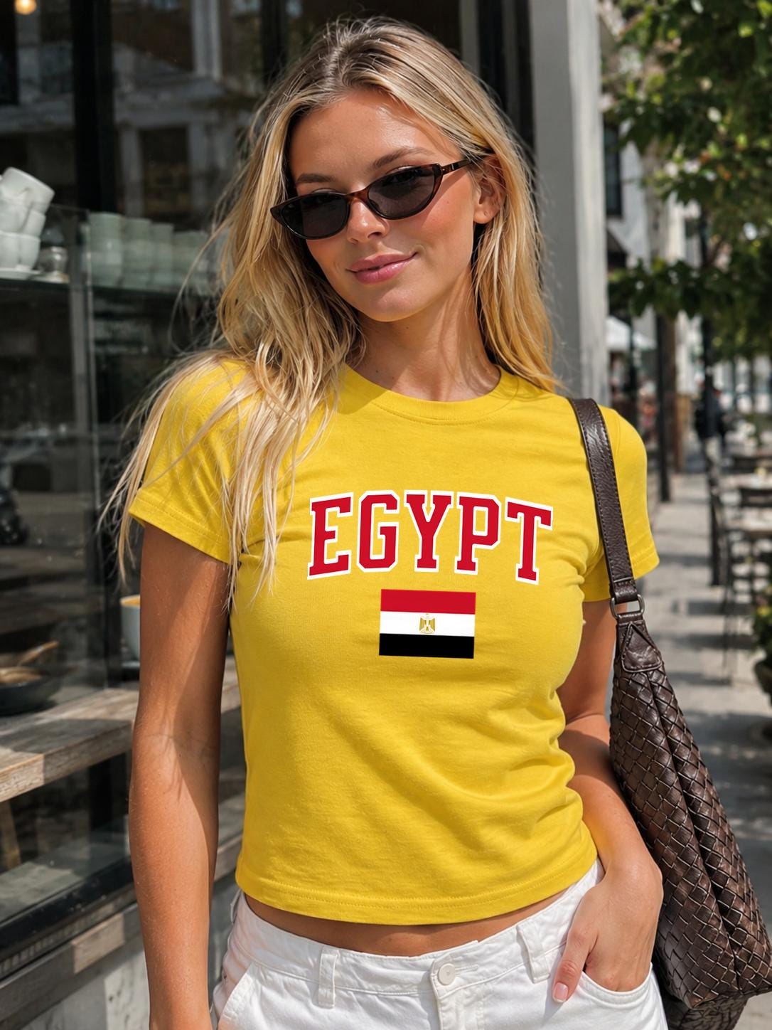 Black baby tee with red EGYPT varsity lettering and Egyptian flag graphic.