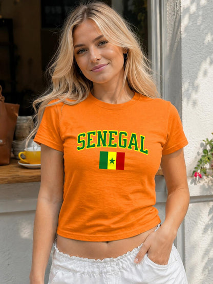Fitted green baby tee with arched Senegal lettering and Senegal flag graphic
