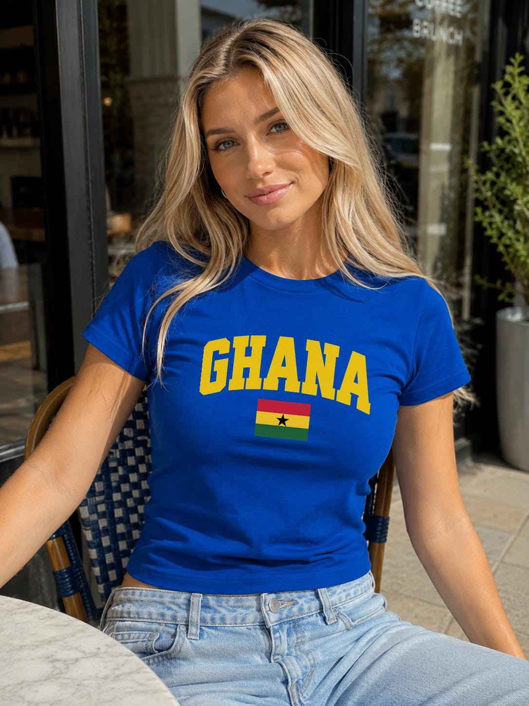 Red baby tee with yellow GHANA lettering and Ghana flag with black star