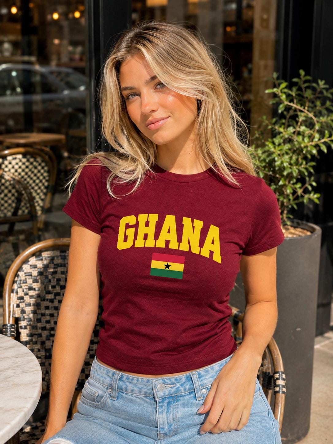 Red baby tee with yellow GHANA lettering and Ghana flag with black star