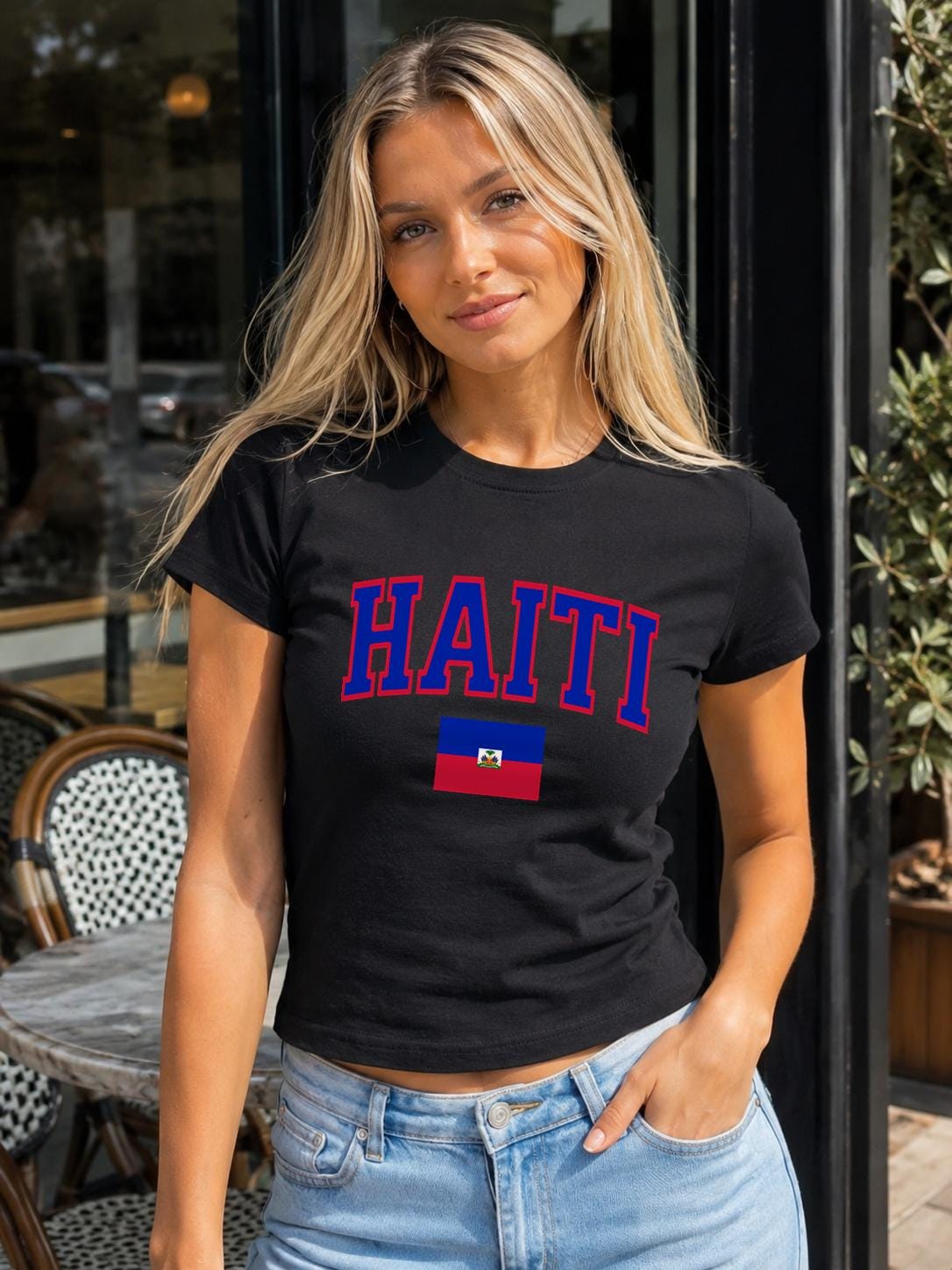 Navy baby tee with bold HAITI varsity lettering and Haitian flag graphic