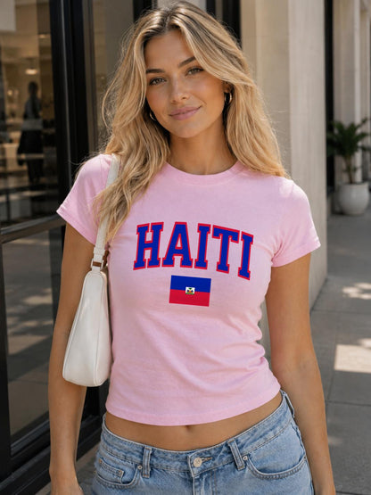 Navy baby tee with bold HAITI varsity lettering and Haitian flag graphic