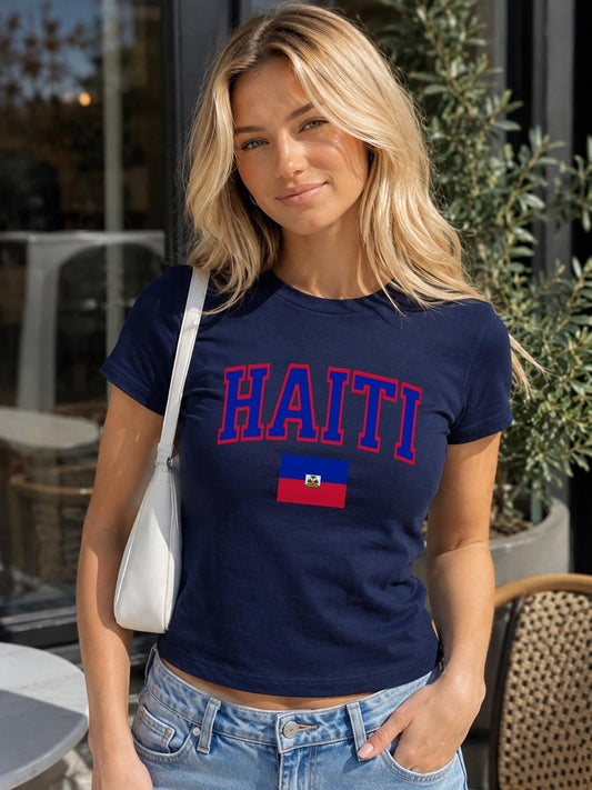 Navy baby tee with bold HAITI varsity lettering and Haitian flag graphic