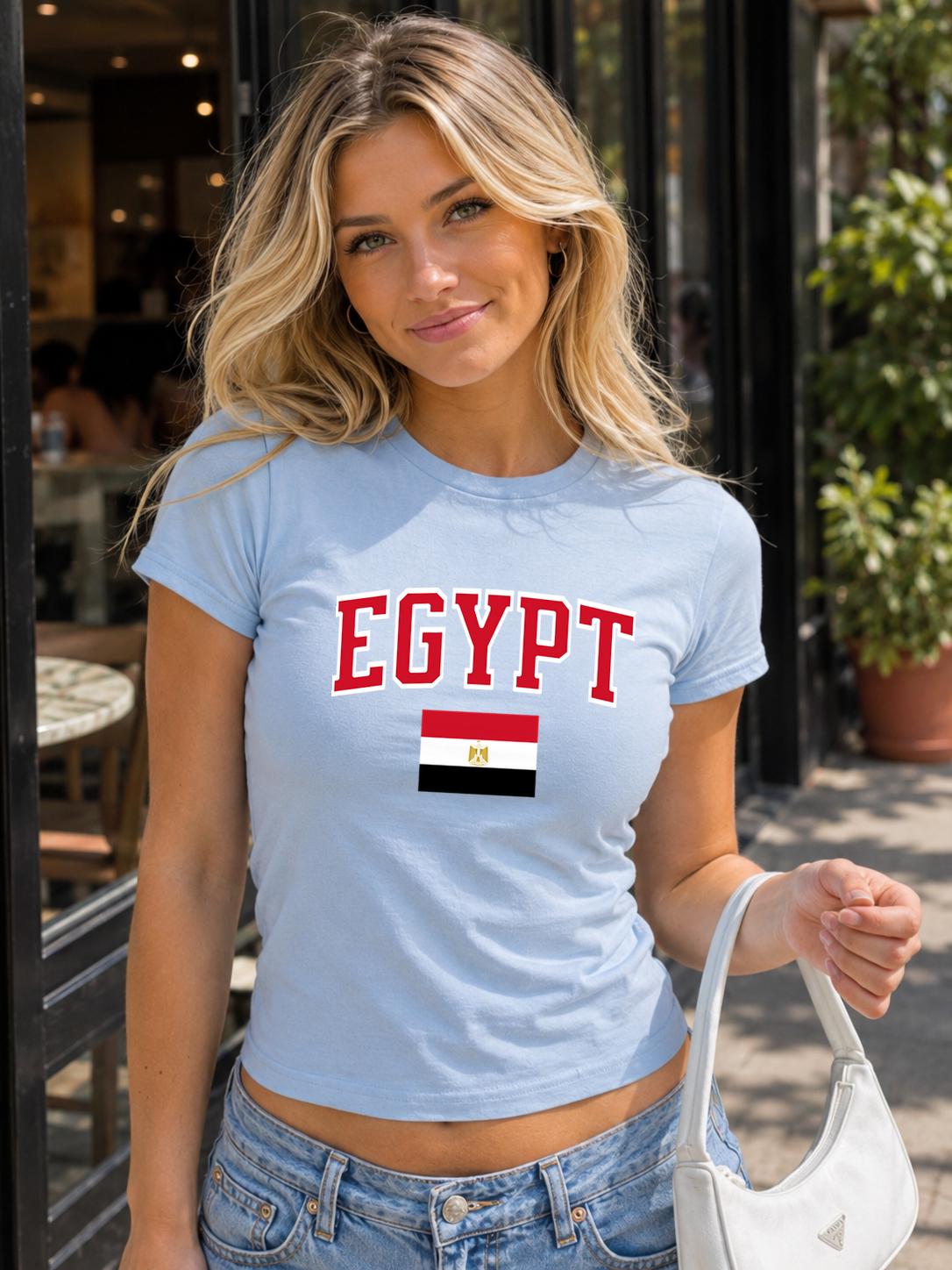 Black baby tee with red EGYPT varsity lettering and Egyptian flag graphic.