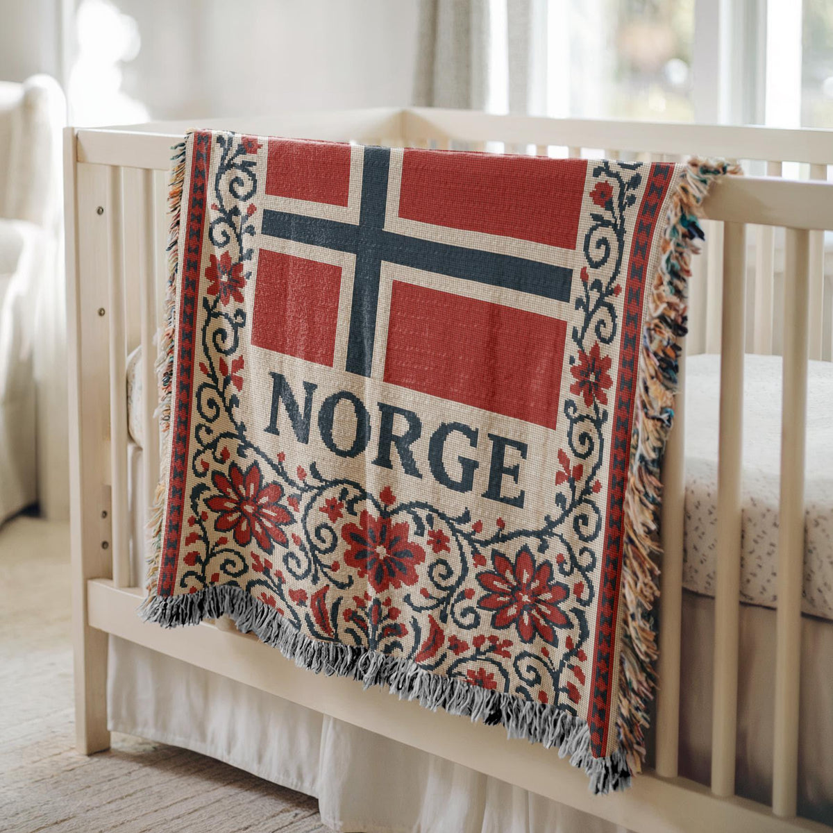 Woven blanket with Norway flag, NORGE text, red floral Nordic border, and fringe edges