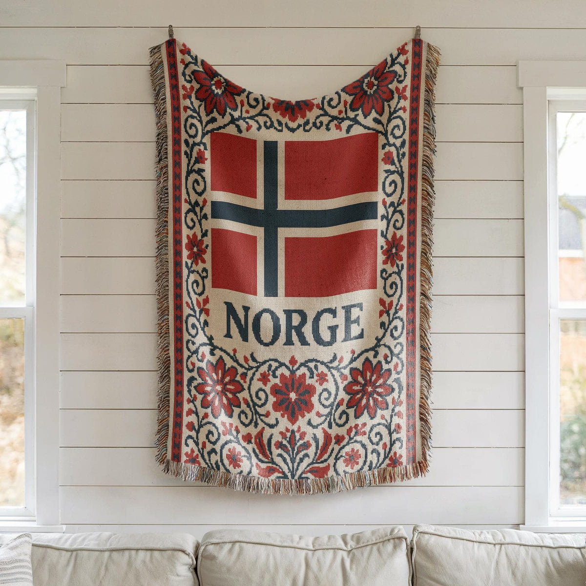 Woven blanket with Norway flag, NORGE text, red floral Nordic border, and fringe edges