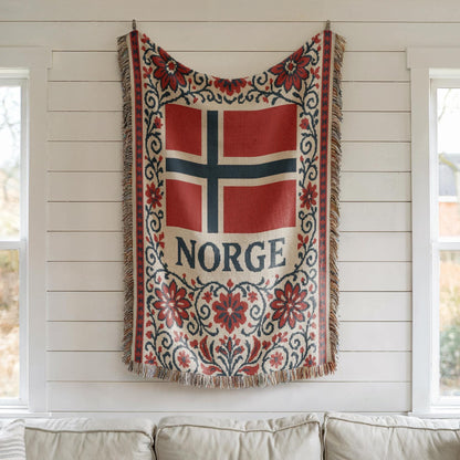 Woven blanket with Norway flag, NORGE text, red floral Nordic border, and fringe edges