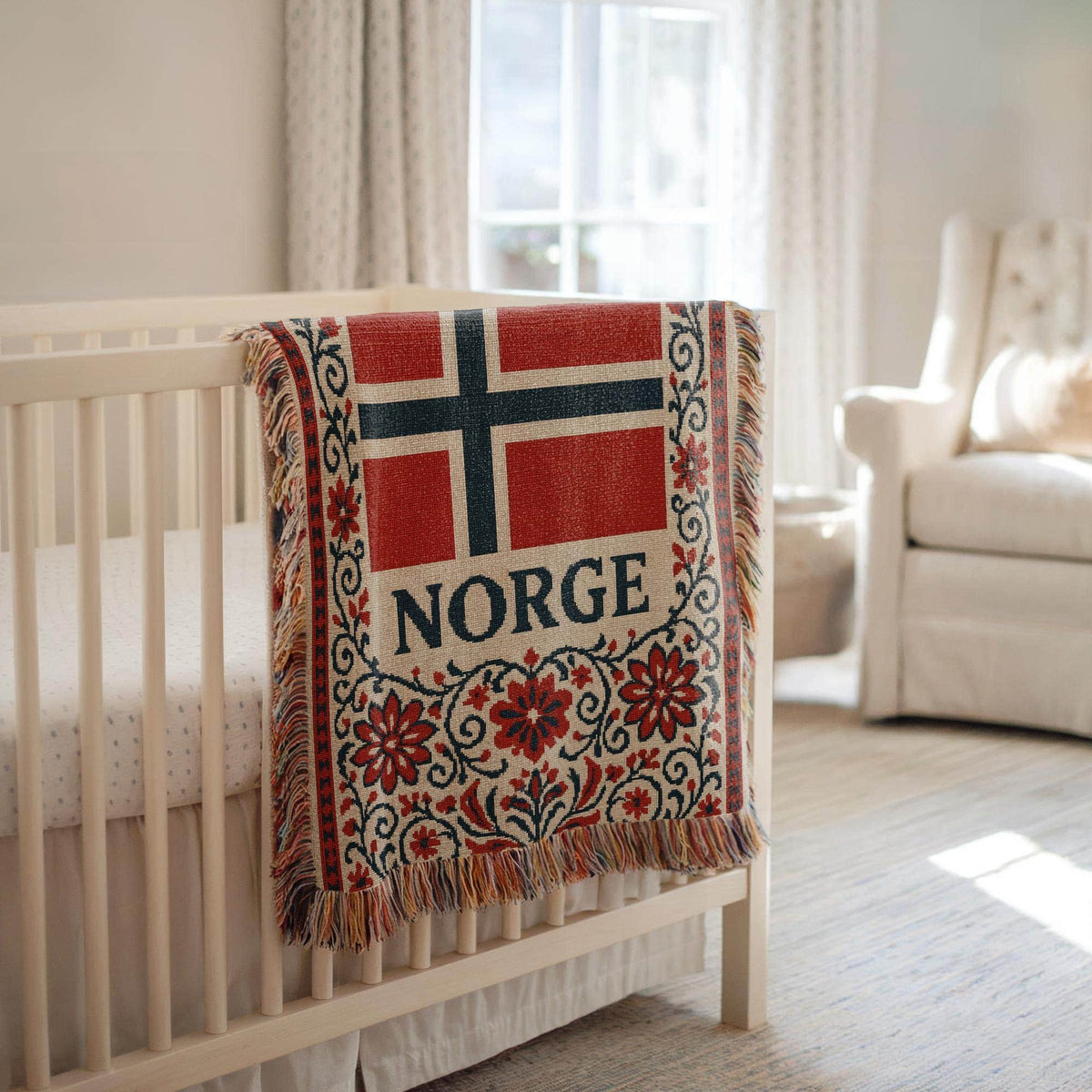 Woven blanket with Norway flag, NORGE text, red floral Nordic border, and fringe edges